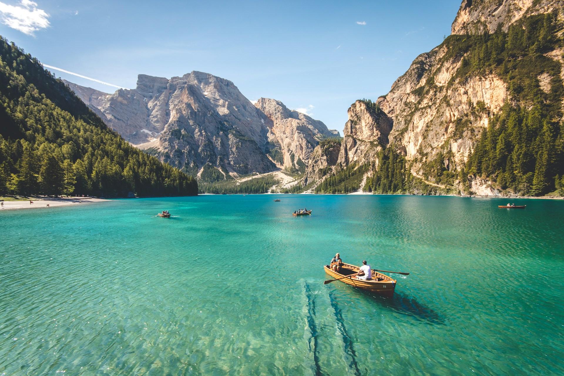 People on rowing on a holiday lake